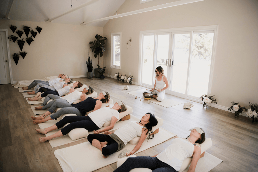 Women enjoying a sound healing sessions as part of their wellness retreat itinerary.