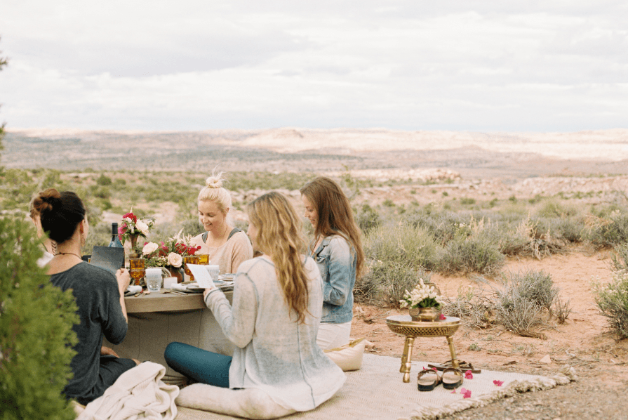 Women having an picnic dinner as one of their retreat activities.