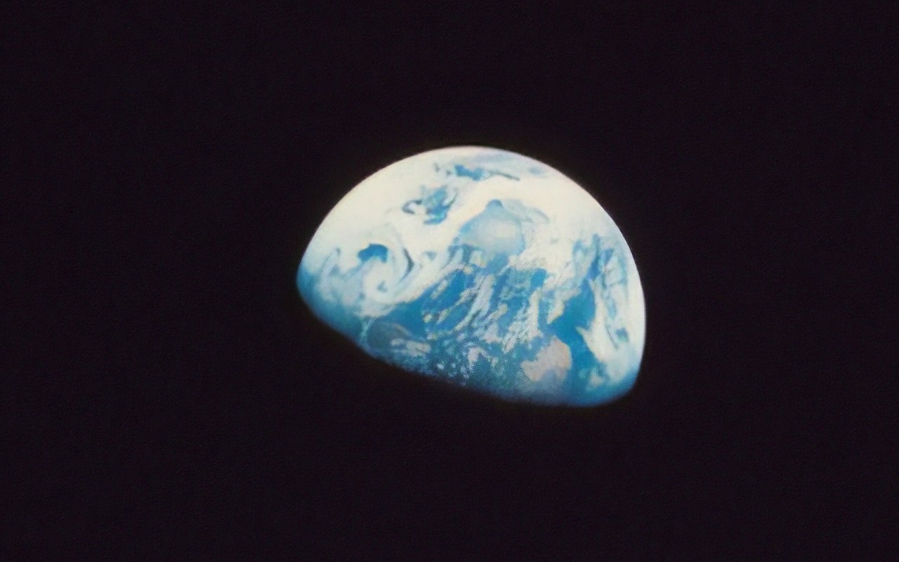 A partial view of Earth from space against a black background.